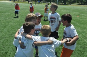 Huddle Youth Football Camps of the Chicago Bears; Non-Contact Summer Camp Instruction for Kids Ages 6-14 Years old, featuring Chicago Bears Heroes
